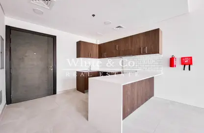 Kitchen image for: Apartment - 2 Bedrooms - 2 Bathrooms for sale in Casa Grande - Jumeirah Village Circle - Dubai, Image 1