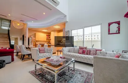 Living Room image for: Villa - 5 Bedrooms - 6 Bathrooms for sale in Les Maisonettes - Jumeirah Village Circle - Dubai, Image 1