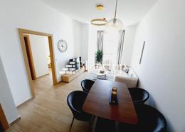 Living / Dining Room image for: Apartment - 1 bedroom - 2 bathrooms for rent in Regina Tower - Jumeirah Village Circle - Dubai, Image 1