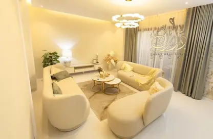 صورة لـ غرفة المعيشة فيلا - 4 غرف نوم - 5 حمامات للبيع في تاونهاوس بلومنجديل - بلومنغدايل - مدينة دبي الرياضية - دبي ، صورة رقم 1