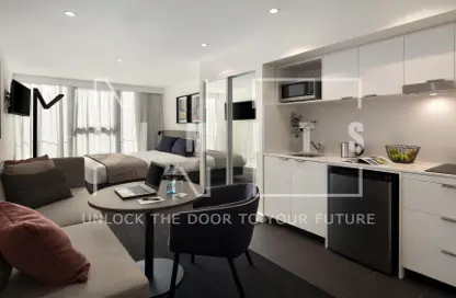 Living Room image for: Apartment - 1 Bathroom for sale in Q Gardens Lofts - Jumeirah Village Circle - Dubai, Image 1