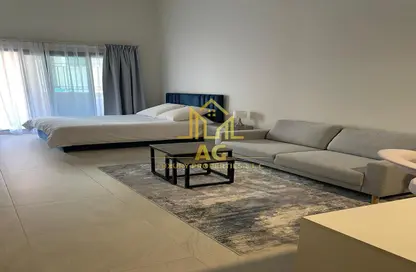 Living Room image for: Apartment - 1 Bathroom for rent in Casa Grande - Jumeirah Village Circle - Dubai, Image 1