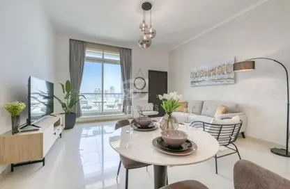 Living / Dining Room image for: Apartment - 1 Bedroom - 2 Bathrooms for rent in Botanica Tower - Dubai Marina - Dubai, Image 1