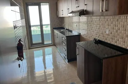 Kitchen image for: Apartment - 2 Bedrooms - 3 Bathrooms for sale in Conquer Tower - Sheikh Maktoum Bin Rashid Street - Ajman, Image 1