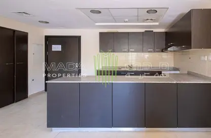 Kitchen image for: Apartment - 2 Bedrooms - 3 Bathrooms for sale in Al Thamam 53 - Al Thamam - Remraam - Dubai, Image 1