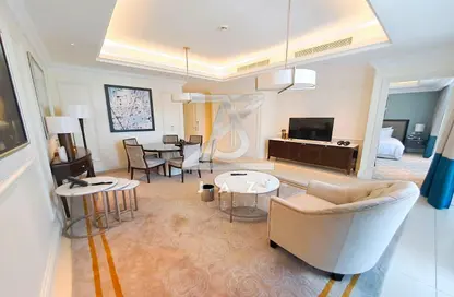 Living / Dining Room image for: Apartment - 2 Bedrooms - 2 Bathrooms for rent in Kempinski BLVD - Downtown Dubai - Dubai, Image 1