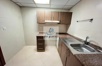 صورة لـ مطبخ شقة - غرفة نوم - 1 حمام للايجار في مجمع النهدة السكني - النهدة - الشارقة ، صورة رقم 1