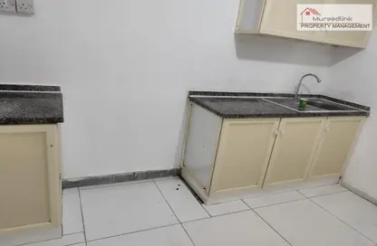 صورة لـ مطبخ شقة - 1 حمام للايجار في الزهراء - أبوظبي ، صورة رقم 1