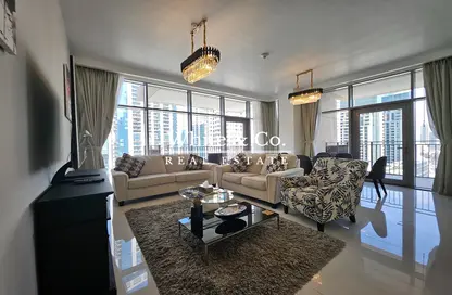 Living Room image for: Apartment - 2 Bedrooms - 3 Bathrooms for sale in Boulevard Crescent 2 - BLVD Crescent - Downtown Dubai - Dubai, Image 1