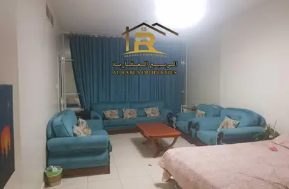 Living Room image for: Apartment - 1 Bedroom - 2 Bathrooms for sale in Crown Palace Hotel - Al Rashidiya 1 - Al Rashidiya - Ajman, Image 1