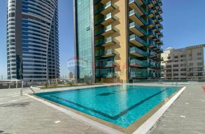 Pool image for: Apartment - 1 Bathroom for sale in The Square Tower - Jumeirah Village Circle - Dubai, Image 1