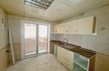 Kitchen image for: Apartment - 2 Bedrooms - 2 Bathrooms for rent in Safia Tower - Al Majaz 3 - Al Majaz - Sharjah, Image 1