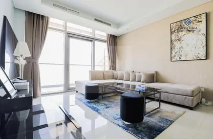 Living Room image for: Apartment - 2 Bedrooms - 3 Bathrooms for rent in Paramount Tower Hotel  and  Residences - Business Bay - Dubai, Image 1