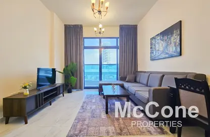 Living Room image for: Apartment - 1 Bedroom - 2 Bathrooms for rent in Sydney Tower - Jumeirah Village Circle - Dubai, Image 1