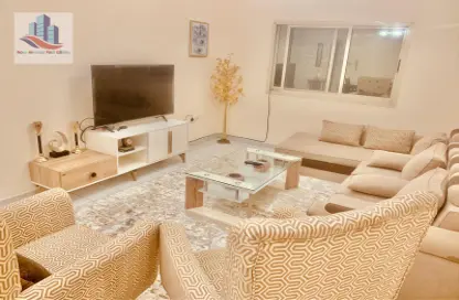 Living Room image for: Apartment - 2 Bedrooms - 2 Bathrooms for rent in Al Shahid Tower - Al Qasba - Sharjah, Image 1