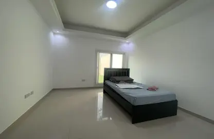 Room / Bedroom image for: Apartment - 1 Bathroom for rent in Khalifa City - Abu Dhabi, Image 1