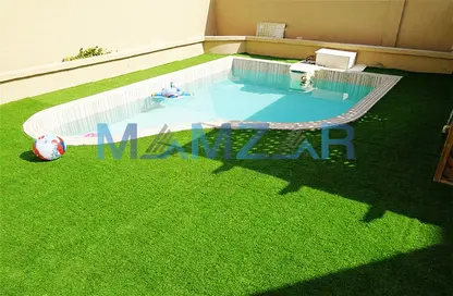 Pool image for: Compound - Studio for sale in Khalifa City A Villas - Khalifa City A - Khalifa City - Abu Dhabi, Image 1