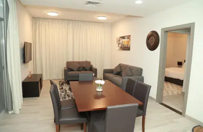 Living / Dining Room image for: Apartment - 2 Bedrooms - 3 Bathrooms for rent in Penrose Place - District 13 - Jumeirah Village Circle - Dubai, Image 1