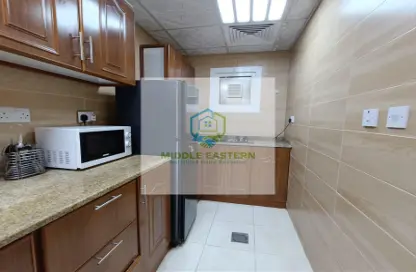 صورة لـ مطبخ شقة - 1 حمام للايجار في برج المرور - منطقة المرور - أبوظبي ، صورة رقم 1