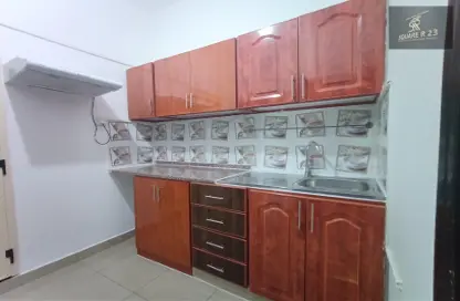 صورة لـ مطبخ شقة - 1 حمام للايجار في 6 فلل محمد - مدينة محمد بن زايد - أبوظبي ، صورة رقم 1