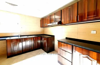 Kitchen image for: Apartment - 1 Bedroom - 2 Bathrooms for rent in Al Wahda - Sharjah, Image 1