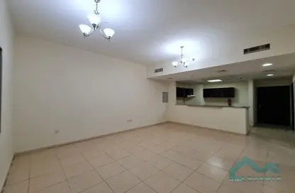 Empty Room image for: Apartment - 1 Bedroom - 2 Bathrooms for rent in Mazaya 10B - Queue Point - Dubai Land - Dubai, Image 1