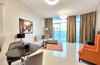Living / Dining Room image for: Apartment - 1 Bedroom - 2 Bathrooms for sale in Artesia B - Artesia - DAMAC Hills - Dubai, Image 1