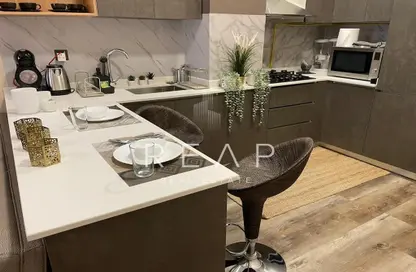 صورة لـ مطبخ شقة - غرفة نوم - 1 حمام للبيع في بانثيون ايليسي - قرية الجميرا سركل - دبي ، صورة رقم 1