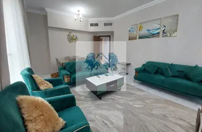 صورة لـ غرفة المعيشة شقة - غرفة نوم - 2 حمامات للايجار في كورنيش عجمان - عجمان ، صورة رقم 1