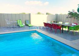 Pool image for: Villa - 5 bedrooms - 7 bathrooms for sale in Contemporary Style - Al Reef Villas - Al Reef - Abu Dhabi, Image 1