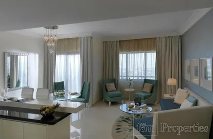 Living Room image for: Apartment - 1 Bedroom - 2 Bathrooms for sale in The Signature - Burj Khalifa Area - Downtown Dubai - Dubai, Image 1