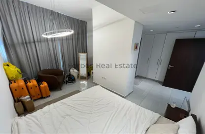 Room / Bedroom image for: Apartment - 1 Bedroom - 2 Bathrooms for sale in O2 Tower - Jumeirah Village Circle - Dubai, Image 1