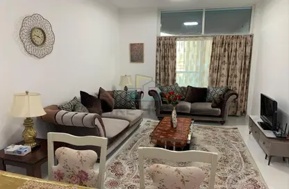 Living Room image for: Apartment - 1 Bedroom - 2 Bathrooms for rent in Arabian Gate - Dubai Silicon Oasis - Dubai, Image 1