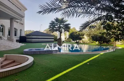 Garden image for: Villa - 7 Bedrooms for rent in Al Karamah - Abu Dhabi, Image 1