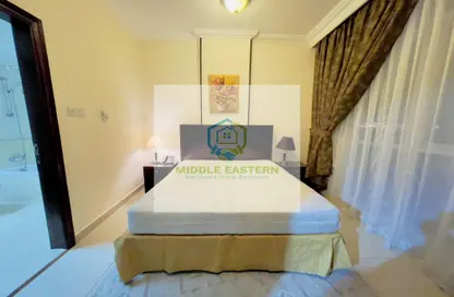 Room / Bedroom image for: Apartment - 1 Bedroom - 2 Bathrooms for rent in Al Dhafrah Street - Al Mushrif - Abu Dhabi, Image 1