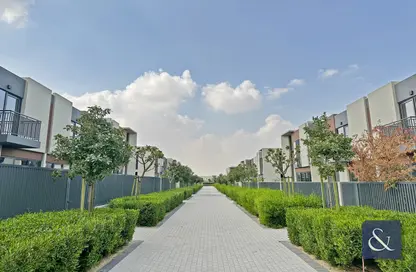 Outdoor Building image for: Townhouse - 3 Bedrooms - 4 Bathrooms for rent in Cherrywoods - Dubai Land - Dubai, Image 1