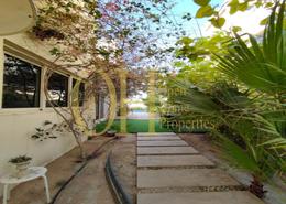 Garden image for: Villa - 5 bedrooms - 6 bathrooms for sale in Lehweih Community - Al Raha Gardens - Abu Dhabi, Image 1