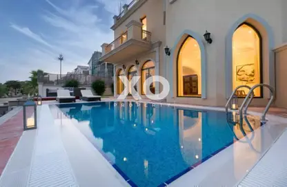 Pool image for: Villa - 5 Bedrooms - 6 Bathrooms for rent in Garden Homes Frond C - Garden Homes - Palm Jumeirah - Dubai, Image 1