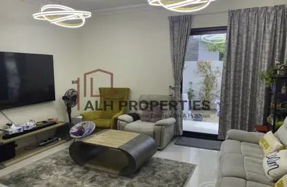 Living Room image for: Villa - 3 Bedrooms - 5 Bathrooms for rent in Aurum Villas - Juniper - Damac Hills 2 - Dubai, Image 1