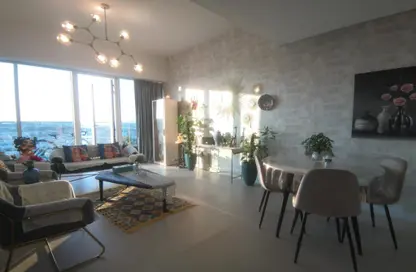 Living / Dining Room image for: Apartment - 1 Bedroom - 2 Bathrooms for sale in PG Upperhouse - Al Furjan - Dubai, Image 1