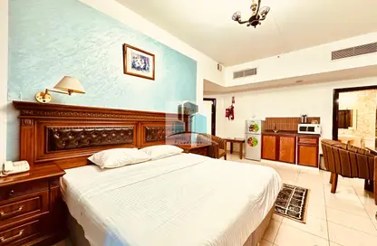 Apartment - Studio - 1 Bathroom for rent in Muraijeb Tower - Hamdan Street - Abu Dhabi