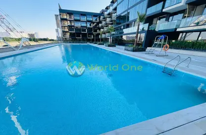 Pool image for: Apartment - 1 Bedroom - 2 Bathrooms for rent in Binghatti Crescent - Jumeirah Village Circle - Dubai, Image 1
