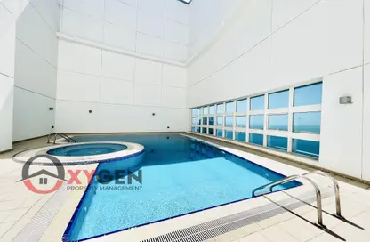 صورة لـ حوض سباحة شقة - 3 غرف نوم - 4 حمامات للايجار في برج الأريام - منطقة النادي السياحي - أبوظبي ، صورة رقم 1