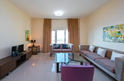 Living Room image for: Apartment - 1 Bedroom - 2 Bathrooms for rent in Suburbia Tower 1 - Suburbia - Downtown Jebel Ali - Dubai, Image 1