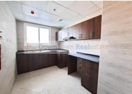 صورةمطبخ لـ: شقة - 2 غرف نوم - 3 حمامات للبيع في برج الواحة - الراشدية 1 - الراشدية - عجمان, صورة 1