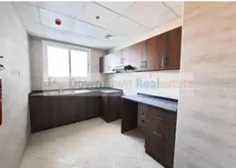 صورة لـ مطبخ شقة - 2 غرف نوم - 3 حمامات للبيع في برج الواحة - الراشدية 1 - الراشدية - عجمان ، صورة رقم 1