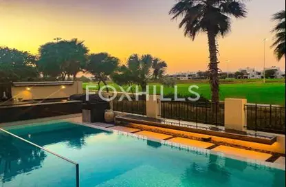 Pool image for: Villa - 5 Bedrooms - 7 Bathrooms for sale in The Field - DAMAC Hills - Dubai, Image 1