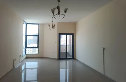 Empty Room image for: Apartment - 1 Bathroom for sale in Nuaimia One Tower - Al Nuaimiya - Ajman, Image 1