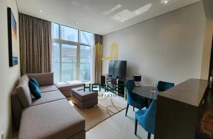 Living / Dining Room image for: Apartment - 2 Bedrooms - 3 Bathrooms for rent in Bay's Edge - Business Bay - Dubai, Image 1