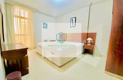 Room / Bedroom image for: Apartment - 2 Bedrooms - 3 Bathrooms for rent in Sheikh Nahyan Bin Zayed Tower - Airport Road - Abu Dhabi, Image 1